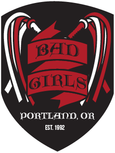Bad Girls Logo black badge with two red and white floggers crossed at the center - red banner in center says Bad Girls and below says Portland, OR established in 1992.